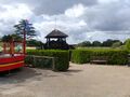 Log-Hut surrounded by Green-Hedge at Tilgate Park, West Sussex, England