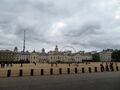 Horse Guards Parade with the London Eye Ferris wheel in the background.