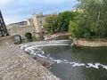 Palladian Pulteney Bridge and the weir on Avon River at Bath England — in Bath, England.