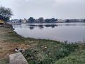 A view of the village from the Eastern side. The largest pond of the village is located on this side of the village, which is used for cattle.