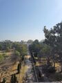 View of the Palace from atop onde of the many gateways positioned along entire length of wall surrounding gardens and palace. Wall was 14 feet high and gateposts which were numerous are mostly dilapidated today.