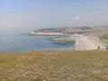 Chalk cliff as seen from another cliff of Seven Sisters East Sussex, England, river Cuckmere joins English Channel